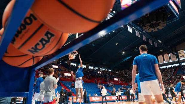 Kansas players warm up before the start of Saturday's HyVee Hoops Border Showdown against Missouri inside Allen Fieldhouse.